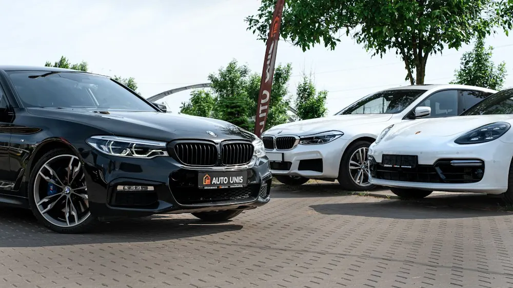 Group of cars parked on a dealership lot