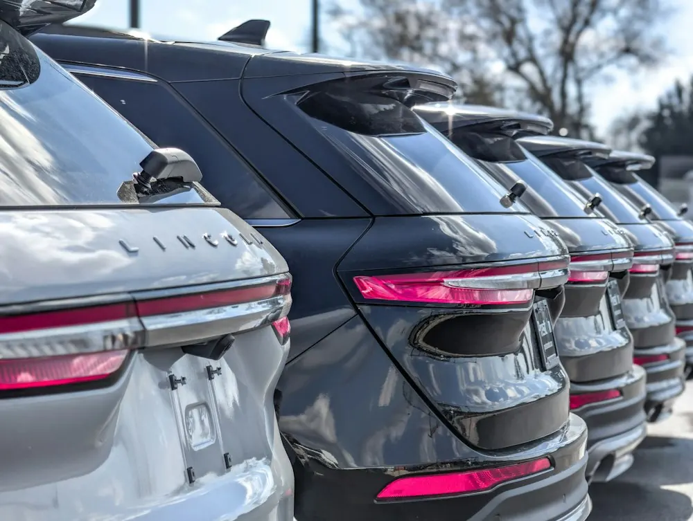 Row of SUVs parked on a dealership lot