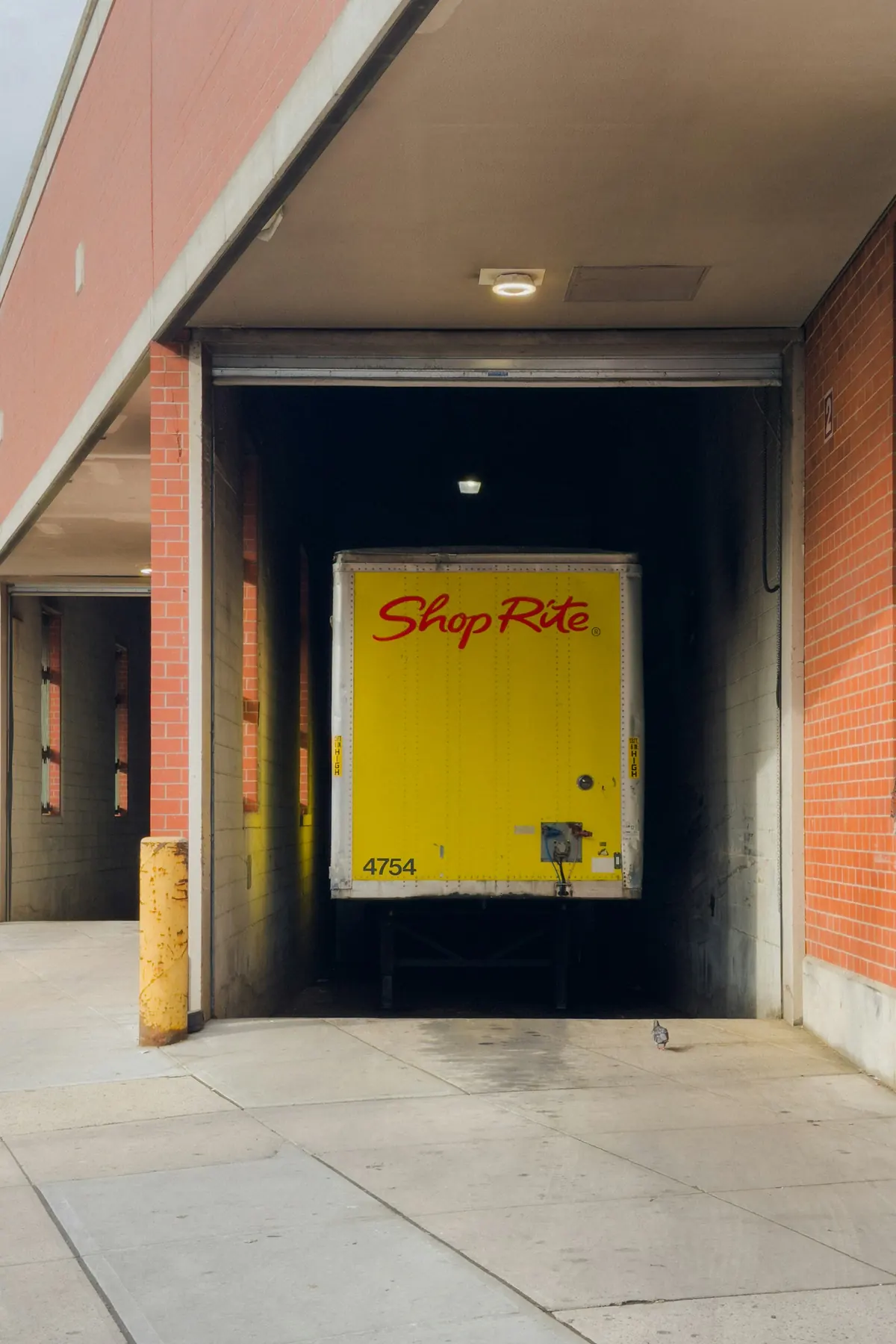 Delivery truck backed into a warehouse loading dock