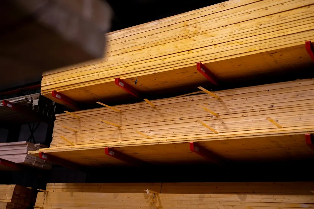Stacks of pine lumber on warehouse shelving