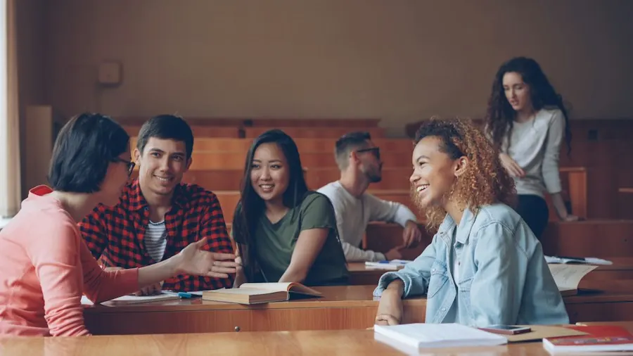 Students talking and laughing together in a lecture hall