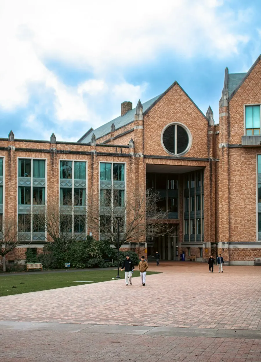 Students walking past a brick campus building