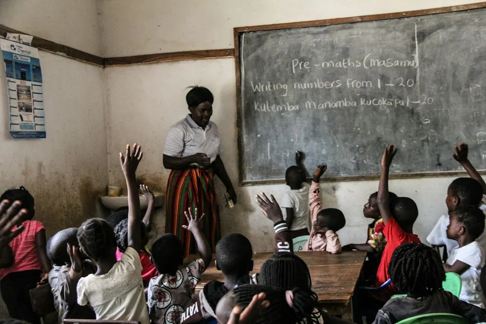 Teacher leading a class of young children