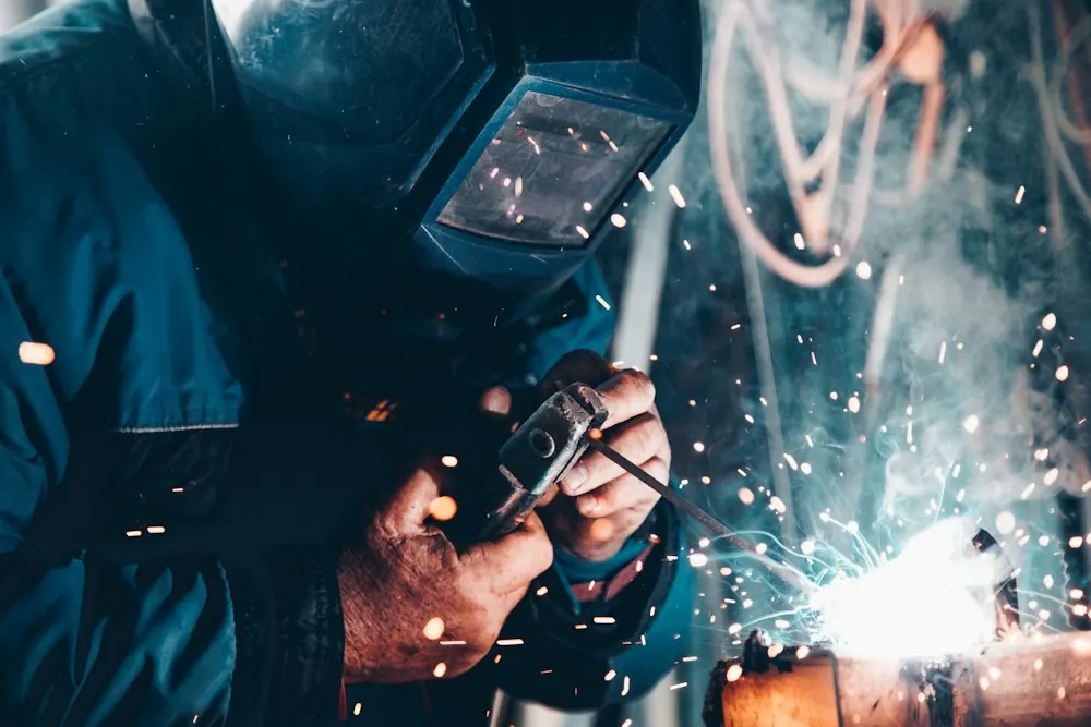 Trainee using a welding machine