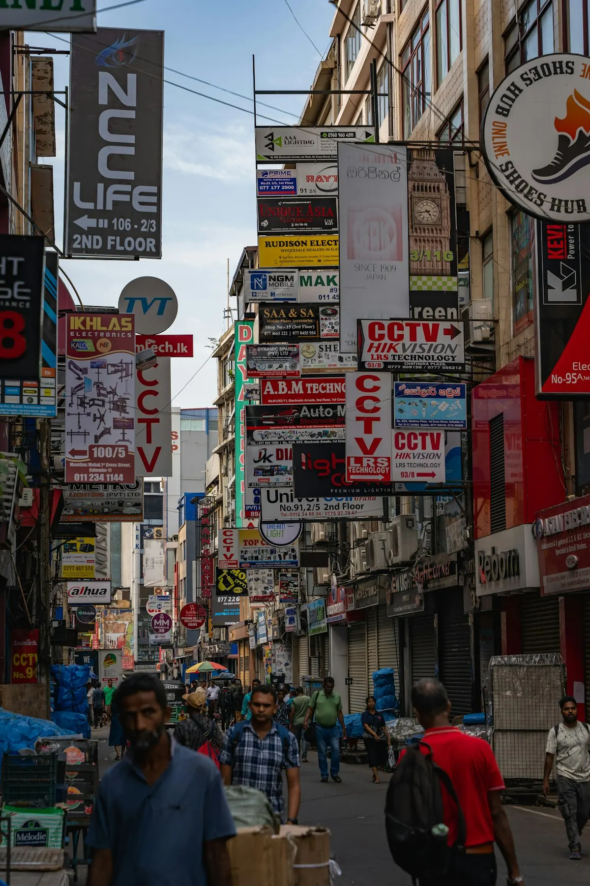 Busy city street lined with business signs