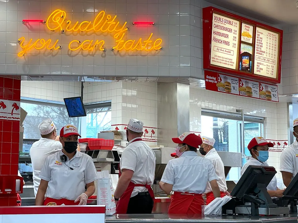 Customers standing in line at a quick-service restaurant