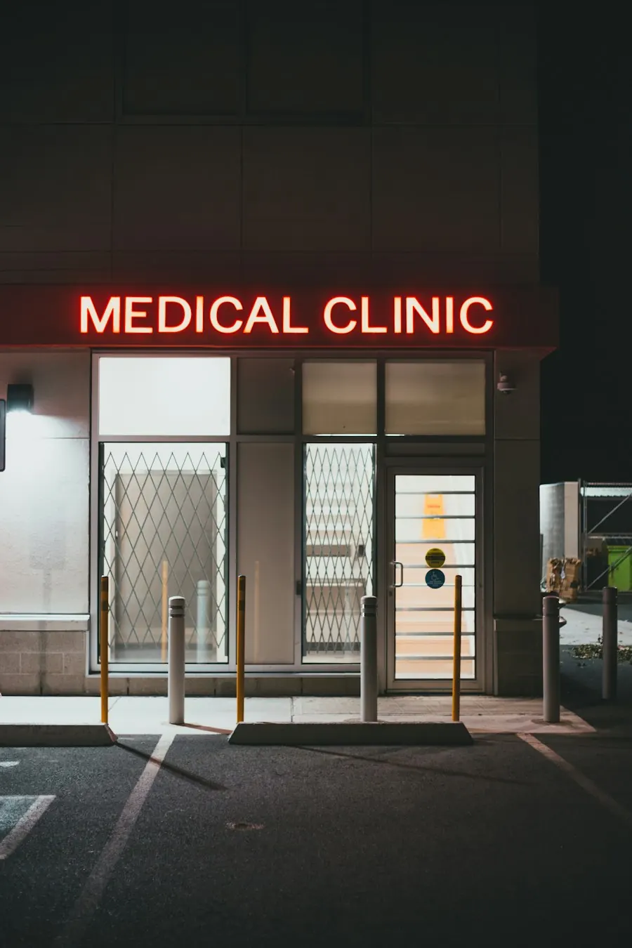 Medical clinic storefront at night