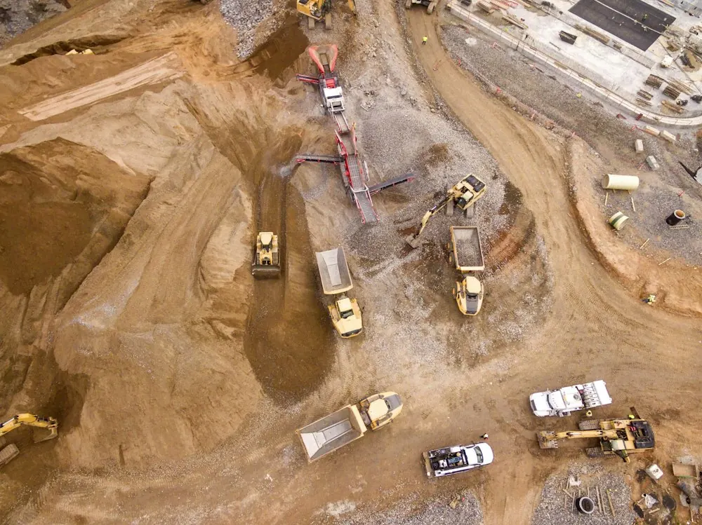 Aerial view of dump trucks at a construction site