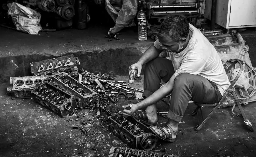 Technician working on engine parts outdoors