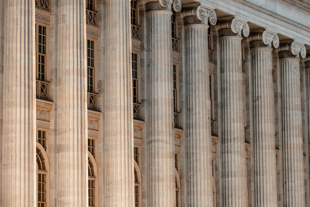 Courthouse building with columns and a clock