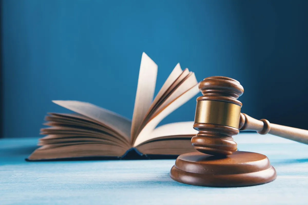 Judge’s gavel resting beside an open law book