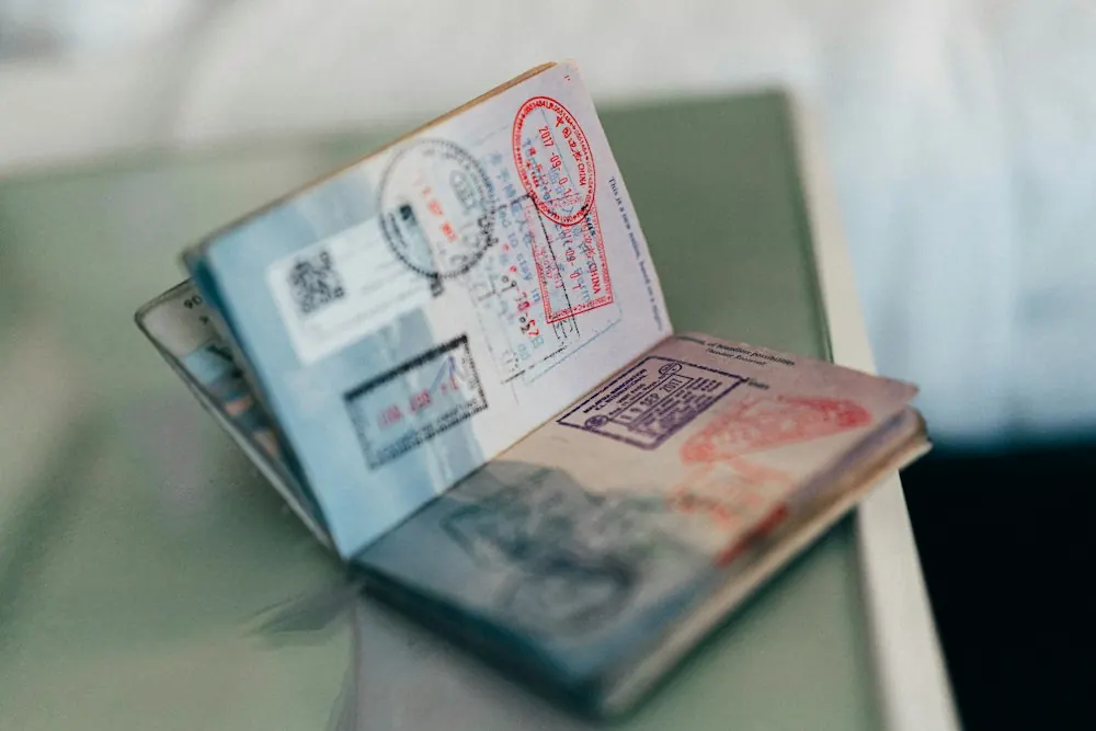 Open passport with colorful ink stamps