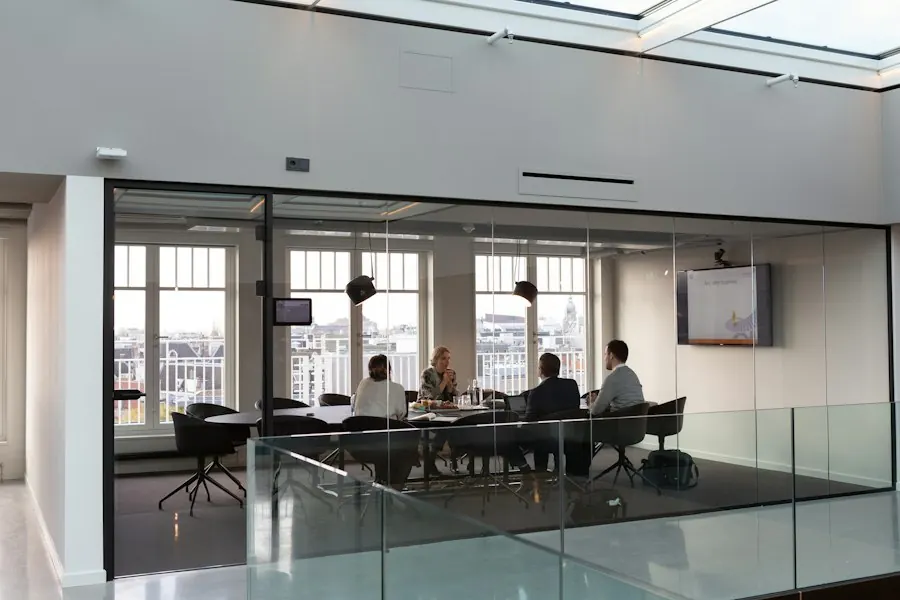 Team meeting in a glass meeting room