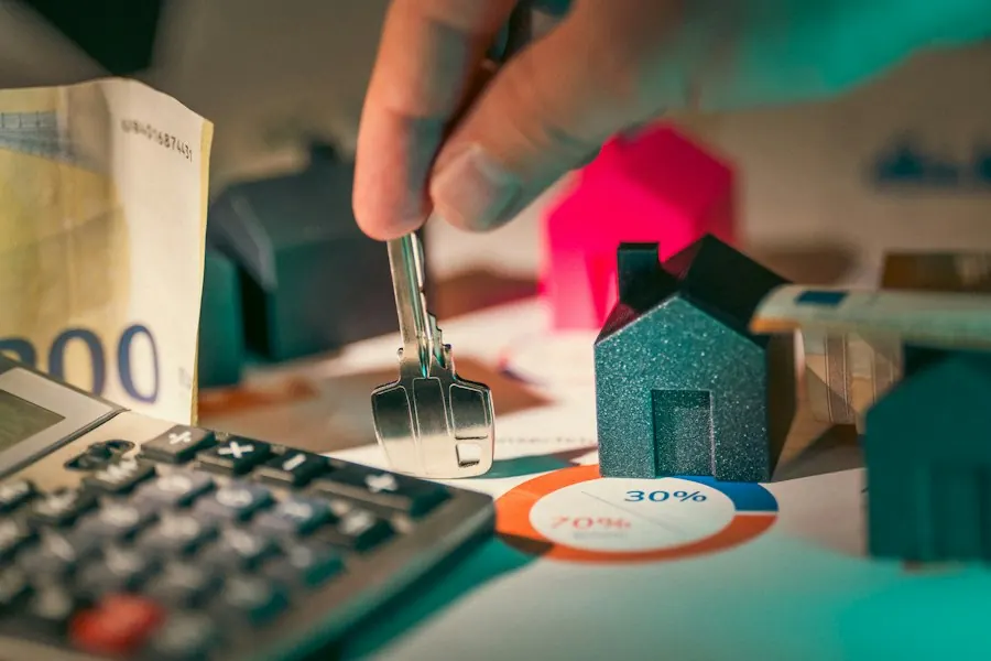 House model and calculator on a desk