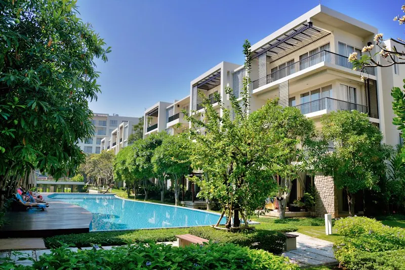 Apartment complex with pool and garden