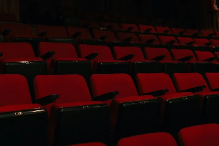 Rows of empty red cinema seats
