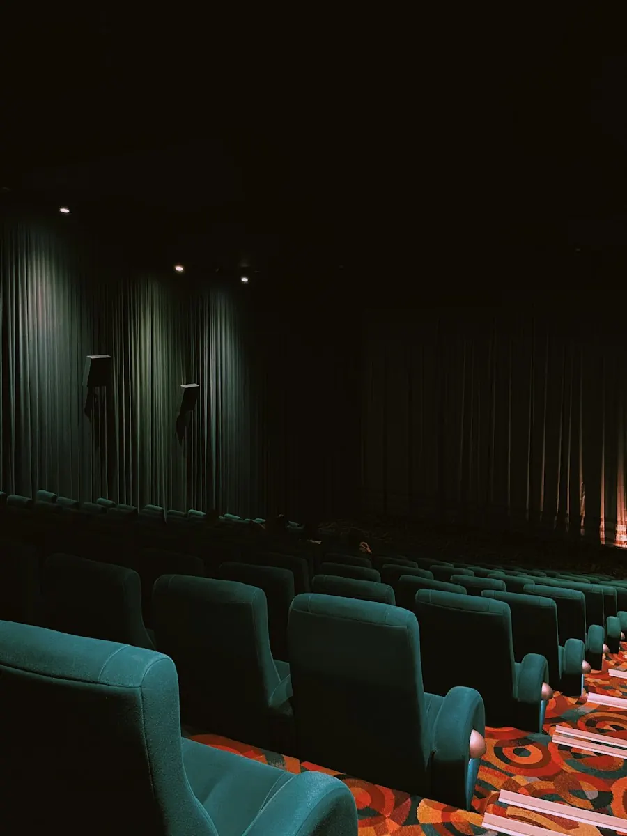 Dark cinema with a lit screen